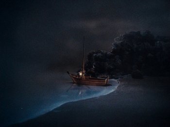 Movie still from “Rudolph's Shiny New Year” (1976), directed by Jules Bass – A boat that is in the water at night; Extreme Wide shot, High angle