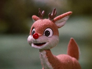 Movie still from “Rudolph's Shiny New Year” (1976), directed by Jules Bass – A stuffed toy reindeer with a red nose; Extreme Close Up shot, Low angle