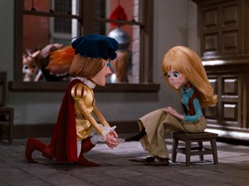 Movie still from “Rudolph's Shiny New Year” (1976), directed by Jules Bass – A woman sitting on top of a chair next to a man; Wide shot, Over the shoulder angle