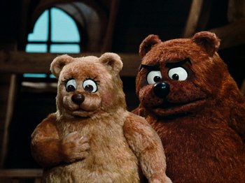 Movie still from “Rudolph's Shiny New Year” (1976), directed by Jules Bass – Two teddy bears with big eyes and one is brown and the other is brown; Close Up shot, Low angle