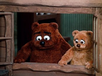 Movie still from “Rudolph's Shiny New Year” (1976), directed by Jules Bass – Two teddy bears are sitting next to each other; Close Up shot, Low angle