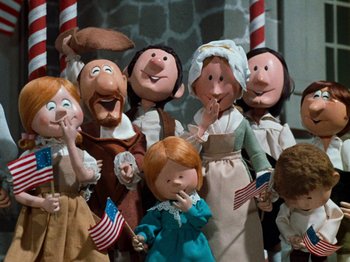 Movie still from “Rudolph's Shiny New Year” (1976), directed by Jules Bass – A group of people dressed up like american presidents and first ladies; Medium shot, Low angle