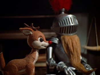Movie still from “Rudolph's Shiny New Year” (1976), directed by Jules Bass – A reindeer and a knight in a suit of armor; Close Up shot, High angle