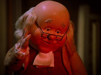 Movie still from “Rudolph's Shiny New Year” (1976), directed by Jules Bass – The face of a clown doll; Close Up shot, High angle