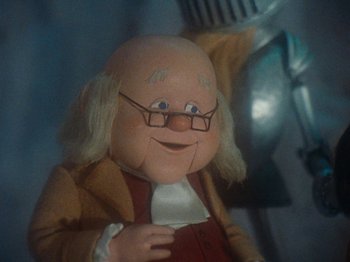 Movie still from “Rudolph's Shiny New Year” (1976), directed by Jules Bass – The face of benjamin franklin; Close Up shot, Over the shoulder angle