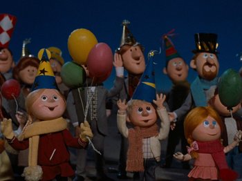 Movie still from “Rudolph's Shiny New Year” (1976), directed by Jules Bass – A group of people wearing party hats and holding balloons; Medium shot, Low angle