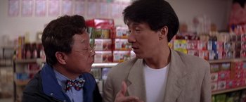 Movie still from “Rumble in the Bronx” (1995), directed by Stanley Tong – A man and a woman talking to each other in a store; Close Up shot, Over the shoulder angle