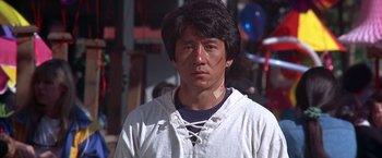 Movie still from “Rumble in the Bronx” (1995), directed by Stanley Tong – A man with a bandage around his neck and chest; Close Up shot, Low angle