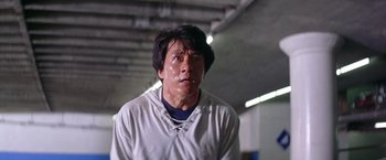 Movie still from “Rumble in the Bronx” (1995), directed by Stanley Tong – A person wearing a hooded sweatshirt; Close Up shot, Low angle