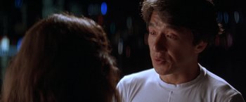 Movie still from “Rumble in the Bronx” (1995), directed by Stanley Tong – A person talking to another person; Close Up shot, Over the shoulder angle