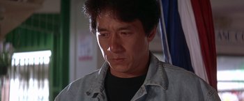 Movie still from “Rumble in the Bronx” (1995), directed by Stanley Tong – A person wearing a jean jacket; Close Up shot, Low angle