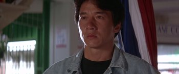 Movie still from “Rumble in the Bronx” (1995), directed by Stanley Tong – A person wearing a jean jacket; Close Up shot, Low angle
