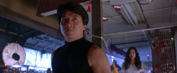 Movie still from “Rumble in the Bronx” (1995), directed by Stanley Tong – A person wearing a black shirt; Close Up shot, Low angle