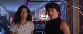 Movie still from “Rumble in the Bronx” (1995), directed by Stanley Tong – A man and a woman standing next to each other; Close Up shot, Low angle