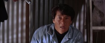 Movie still from “Rumble in the Bronx” (1995), directed by Stanley Tong – A person wearing a jean jacket; Close Up shot, Low angle