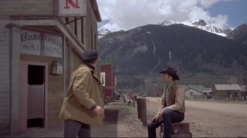 Movie still from “Run for Cover” (1955), directed by Nicholas Ray – Two men are sitting on the side of the road; Wide shot, Over the shoulder angle