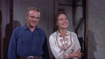 Movie still from “Run for Cover” (1955), directed by Nicholas Ray – A man and a woman standing next to each other; Medium shot, Low angle