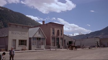 Movie still from “Run for Cover” (1955), directed by Nicholas Ray – An old western town with horses and carriages in front; Extreme Wide shot, High angle