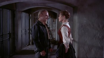 Movie still from “Run for Cover” (1955), directed by Nicholas Ray – A man and a woman standing next to each other; Medium shot, Over the shoulder angle