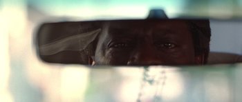 Movie still from “Runaway Jury” (2003), directed by Gary Fleder – A person's eyes looking out a window; Extreme Close Up shot, Low angle