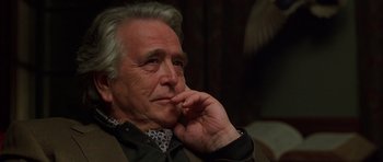 Movie still from “Runaway Jury” (2003), directed by Gary Fleder – An older man sitting in front of a window; Close Up shot, Low angle