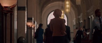 Movie still from “Runaway Jury” (2003), directed by Gary Fleder – A group of people walking down a hall way; Wide shot, Low angle