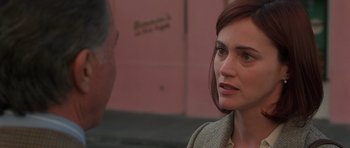 Movie still from “Runaway Jury” (2003), directed by Gary Fleder – A person talking to someone outside; Close Up shot, Over the shoulder angle