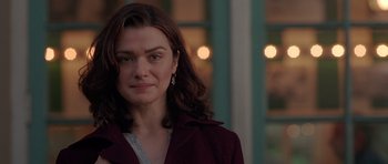 Movie still from “Runaway Jury” (2003), directed by Gary Fleder – A person with long hair; Close Up shot, Over the shoulder angle