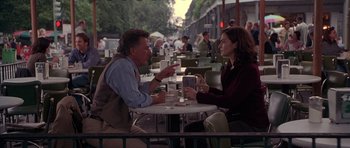 Movie still from “Runaway Jury” (2003), directed by Gary Fleder – A man and a woman are sitting at a table; Medium shot, Over the shoulder angle