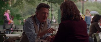 Movie still from “Runaway Jury” (2003), directed by Gary Fleder – A man and a woman sitting at a table talking to each other; Medium shot, Over the shoulder angle