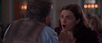 Movie still from “Runaway Jury” (2003), directed by Gary Fleder – A man and a woman looking at each other in a room; Close Up shot, Over the shoulder angle