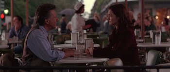 Movie still from “Runaway Jury” (2003), directed by Gary Fleder – A man and a woman are sitting at a table; Medium shot, Over the shoulder angle