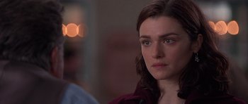 Movie still from “Runaway Jury” (2003), directed by Gary Fleder – A person looking at the camera; Close Up shot, Over the shoulder angle