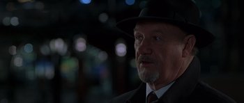 Movie still from “Runaway Jury” (2003), directed by Gary Fleder – An older man wearing a suit and a hat; Close Up shot, Low angle