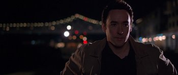 Movie still from “Runaway Jury” (2003), directed by Gary Fleder – A person wearing a brown jacket; Close Up shot, Low angle