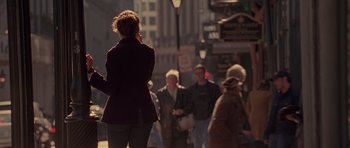 Movie still from “Runaway Jury” (2003), directed by Gary Fleder – A group of people walking down a street; Wide shot, Over the shoulder angle