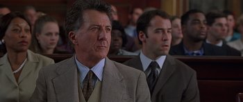 Movie still from “Runaway Jury” (2003), directed by Gary Fleder – Two men in suits and ties sitting in a courtroom; Close Up shot, Low angle