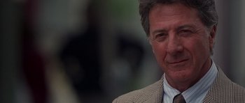 Movie still from “Runaway Jury” (2003), directed by Gary Fleder – A person wearing a suit and tie; Close Up shot, Over the shoulder angle
