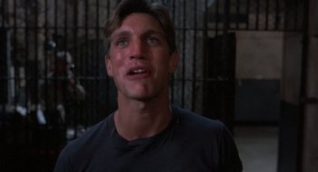 Movie still from “Runaway Train” (1985), directed by Andrey Konchalovskiy – A person with his eyes closed; Close Up shot, Low angle