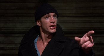 Movie still from “Runaway Train” (1985), directed by Andrey Konchalovskiy – A person wearing a jacket and a hat; Close Up shot, Low angle