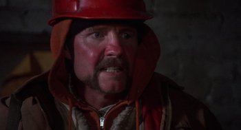 Movie still from “Runaway Train” (1985), directed by Andrey Konchalovskiy – A person wearing a helmet; Close Up shot, Low angle