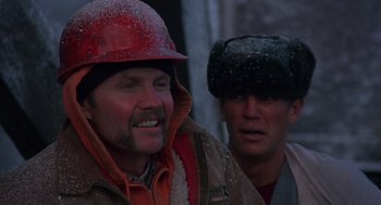 Movie still from “Runaway Train” (1985), directed by Andrey Konchalovskiy – Two men wearing winter hats are smiling for the camera; Close Up shot, Low angle