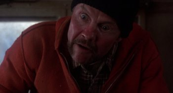 Movie still from “Runaway Train” (1985), directed by Andrey Konchalovskiy – A person wearing a hat and a jacket; Close Up shot, Low angle