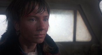 Movie still from “Runaway Train” (1985), directed by Andrey Konchalovskiy – A person wearing a jacket; Close Up shot, Over the shoulder angle