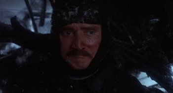 Movie still from “Runaway Train” (1985), directed by Andrey Konchalovskiy – A person wearing a hat; Close Up shot, High angle