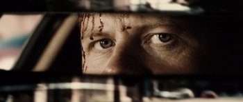 Movie still from “Running Scared” (2006), directed by Wayne Kramer – A person's eyes with blood on them; Extreme Close Up shot, Over the shoulder angle
