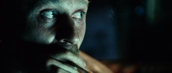 Movie still from “Running Scared” (2006), directed by Wayne Kramer – A person smoking a cigarette; Extreme Close Up shot, Over the shoulder angle