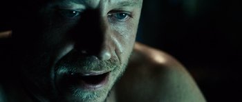 Movie still from “Running Scared” (2006), directed by Wayne Kramer – A man's face with blue eyes; Extreme Close Up shot, High angle
