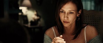 Movie still from “Running Scared” (2006), directed by Wayne Kramer – A person wearing a necklace; Close Up shot, Over the shoulder angle