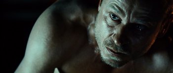 Movie still from “Running Scared” (2006), directed by Wayne Kramer – A man's face and chest; Close Up shot, Over the shoulder angle
